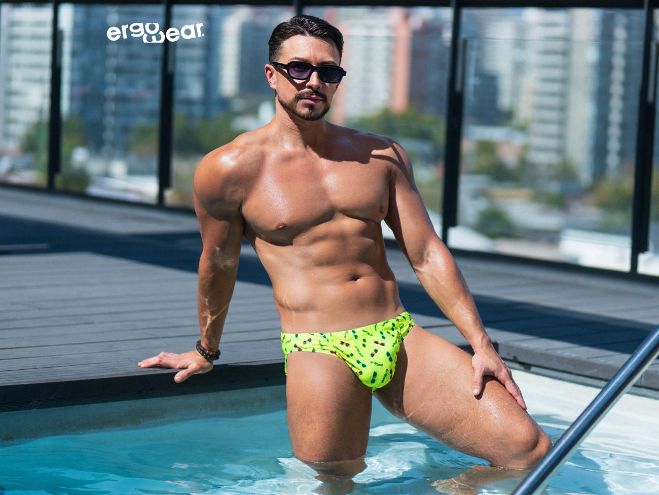 Men's swimwear swim trunks in green leaf pattern form fitting style